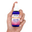 Hand holding a Meowijuana Catnip Spray bottle with a purple label, designed for stimulating play and relief from boredom.