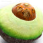 Close-up of avocado toy showing the treat dispensing ball filled with cat treats.