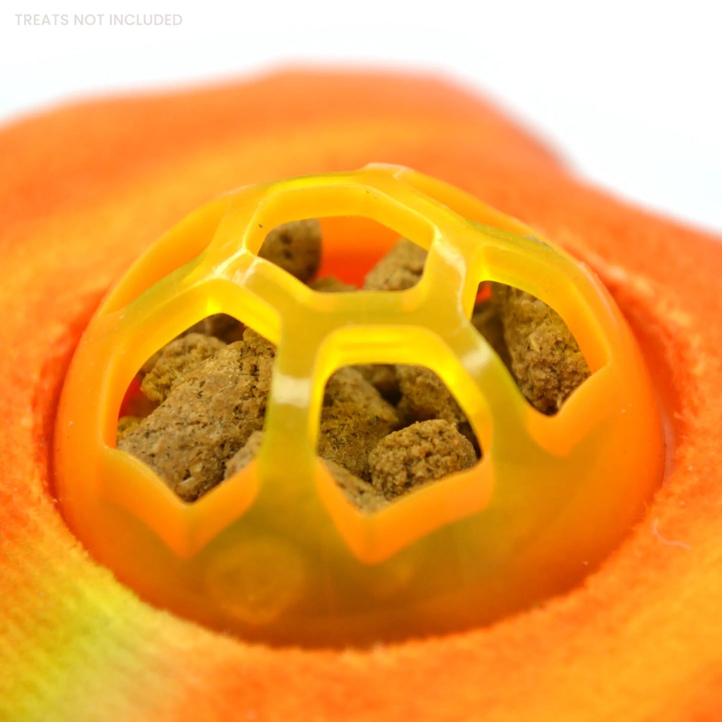 Close-up of the pumpkin toy with treats visible inside the dispensing ball.